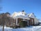 Sunshine and Snow on House and Driveway