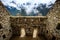 Sunshine view of Machupicchu stone anchient walls and temple among mountains