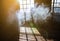 Sunshine window reflection on the wooden floor. Heavy smoke in loft design studio