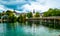 Sunshine wooden bridge over the lake with turquoise water in Hallstatt, Austria