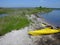 Sunshine yellow kayak on the beach