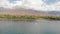 SUP boarding on a very beautiful lake against the backdrop of high mountains.