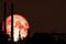 super blood moon back on silhouette refinery oil industry night sky