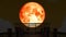 Super blood moon rise back on silhouette bridge on the night sky