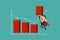 Super businessman lifting bar chart