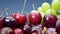 Super close up. Details of cherries, green and red grapes in a basket