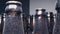 Super close up, rows of empty dusty brown glass bottles