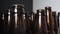 Super close up, rows of empty dusty brown glass bottles