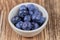 Super food bilberries in a white cup