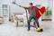 The super hero cleaner working at home