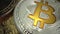 Super MACRO shot of Bitcoin BTC rotate on the table. Trading of gold coin before halving in May. Silver and Gold BTC and