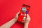 Super Mario Run mobile game published by Nintendo on modern android smart phone in kid hands close-up