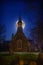 A super moon above the Anglican stone-field church, St. Peter`s of Cookshire-Eaton in Estrie, Quebec, Canada