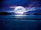 Super moon. Colorful sky with bright full moon over seascape
