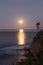 Super moon sets over the Pacific ocean