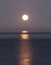 Super moon sets over the Pacific ocean