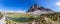 Super panorama of Tre Cime di Lavaredo and mountain lake.