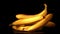 Super slow motion bananas fall on the table. Filmed on a high-speed camera at 1000 fps.