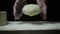 Super slow motion chef tosses dough