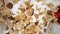Super slow motion of falling cereal pieces into milk, camera motion