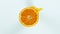 Super slow motion of fresh orange with splashing juice