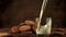 Super slow motion in the glass pour fresh milk. Filmed on a high-speed camera at 1000 fps.