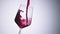 Super slow motion high speed shot of red wine flowing into a big bordeaux wineglass