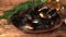 Super slow motion on the mussels in the plate fall water. Filmed on a high-speed camera at 1000 fps.