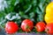 Super Slow Motion Shot of Flying Cuts of Colorful Vegetables and Water Drops on Black background