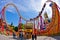 Super wide view of a colorful roller coaster in Prater amusement park at Vienna