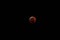 Super wolf blood moon lunar eclipse at full eclipse, red stage