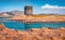 Superb summer view of Spiaggia della Pelosa beach with Torre della Pelosa tower.