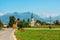 Superb views of the European landscape with road leading to the Church on a Sunny summer day