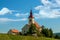 Superb views of the European landscape with road leading to the Church on a Sunny summer day