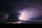 Supercell thunderstorm illuminated by lightning