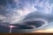 Supercell thunderstorm with lightning bolt and dark storm clouds