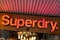Superdry text and sign logo front of british shop clothing company