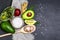 Superfoods on a gray background with copy space: fruit, vegetable, superfood, cereals, leaf vegetable on gray concrete background