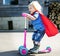 Superhero Baby Boy Using Scooter Adorable Concept