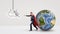 A superhero businessman fighting off a paper drawing of a UFO while behind him stands a small Earth globe.
