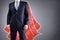 Superhero businessman with red cape concept for leadership