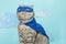 superhero cat, Scottish Whiskas with a blue cloak and mask. The concept of a superhero, super cat, leader