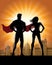 Superhero Couple Silhouette with City Skyline Background