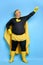 Superhero fat male in mask and protective gloves
