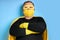 Superhero fat male in mask and protective gloves