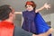 Superhero father and  daughter pretent palying fun together