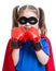 Superhero kid wearing boxing gloves