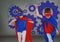 Superhero kids with blank grey background and blue settings cogs icons