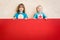 Superheroes children holding red banner blank