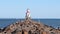 SUPERIOR, WI - 5 OCT 2020: Lighthouse, pier and blue water on a sunny day.